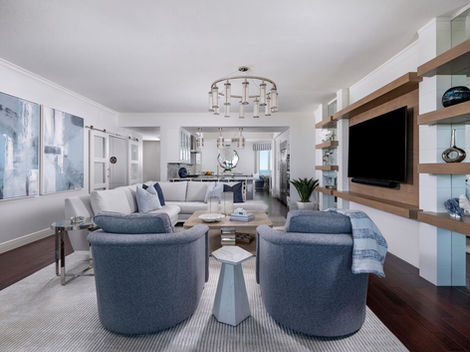 a living room with Contemporary Coastal Tranquility Design  Kalea Bay, Naples FL