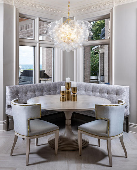 a dining room refined luxury design, warm lighting, sophisticated design, Bay Colony, Naples FL, 