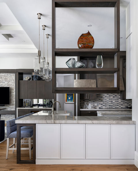 Refined dining area with soft textures and statement lighting in Golfside Manor project