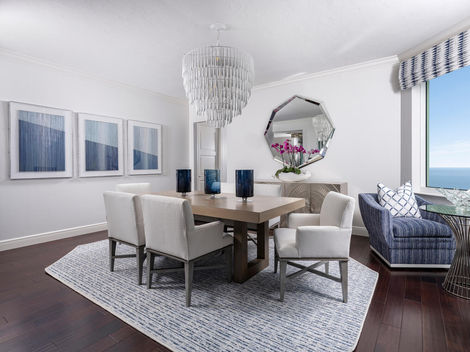 a dining room with Contemporary Coastal Tranquility Design  Kalea Bay, Naples FL