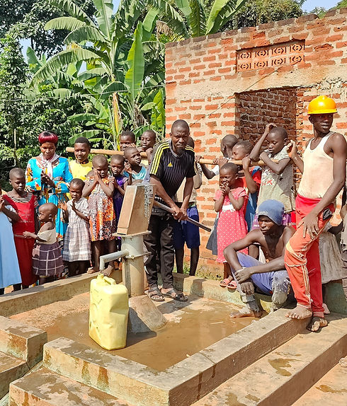 People around a water well in Uganda that provide clean water them