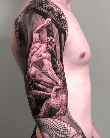 Tattoo of statue Hercules snake and Zeus on full arm sleeve in Black and White Realism by APZ in New York, US.In New York, APZ is a skilled tattoo artist trained by some of the best tattoo artists in the world. He specializes in classic realism tattoos using a modern black and white style, focusing on connected designs and full sleeve tattoos that enhance his clients’ style. His sculpture Hercules snake and Zeus tattoo on full arm speaks volumes with lifelike realistic details.