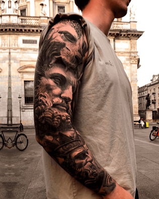 Tattoo of statue Poseidon, Hercules and Lion on full arm sleeve in Black and White Realism by APZ in New York, US.In New York, APZ is a skilled tattoo artist trained by some of the best tattoo artists in the world. He specializes in classic realism tattoos using a modern black and white style, focusing on connected designs and full sleeve tattoos that enhance his clients’ style. His sculpture Poseidon, Hercules and Lion tattoo on full arm speaks volumes with lifelike realistic details.