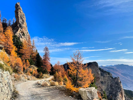 Hiking mountains in Val di Susa in the Italian Alps in September, autumn coloured foliage and blue skies good weather