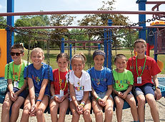 kids sitting on playground bridge.jpg