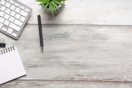 White desk office with laptop, smartphone and other work supplies with cup of coffee. Top