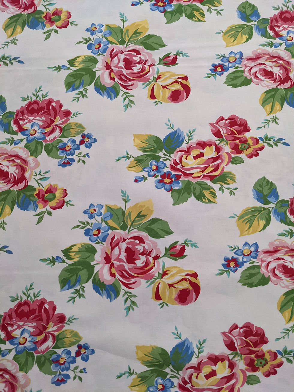 Thumbnail: Floral fabric with large pink roses and blue flowers; elegant background.