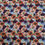 Thumbnail: Floral fabric repeating pattern in orange, purple, and blue blossoms design.