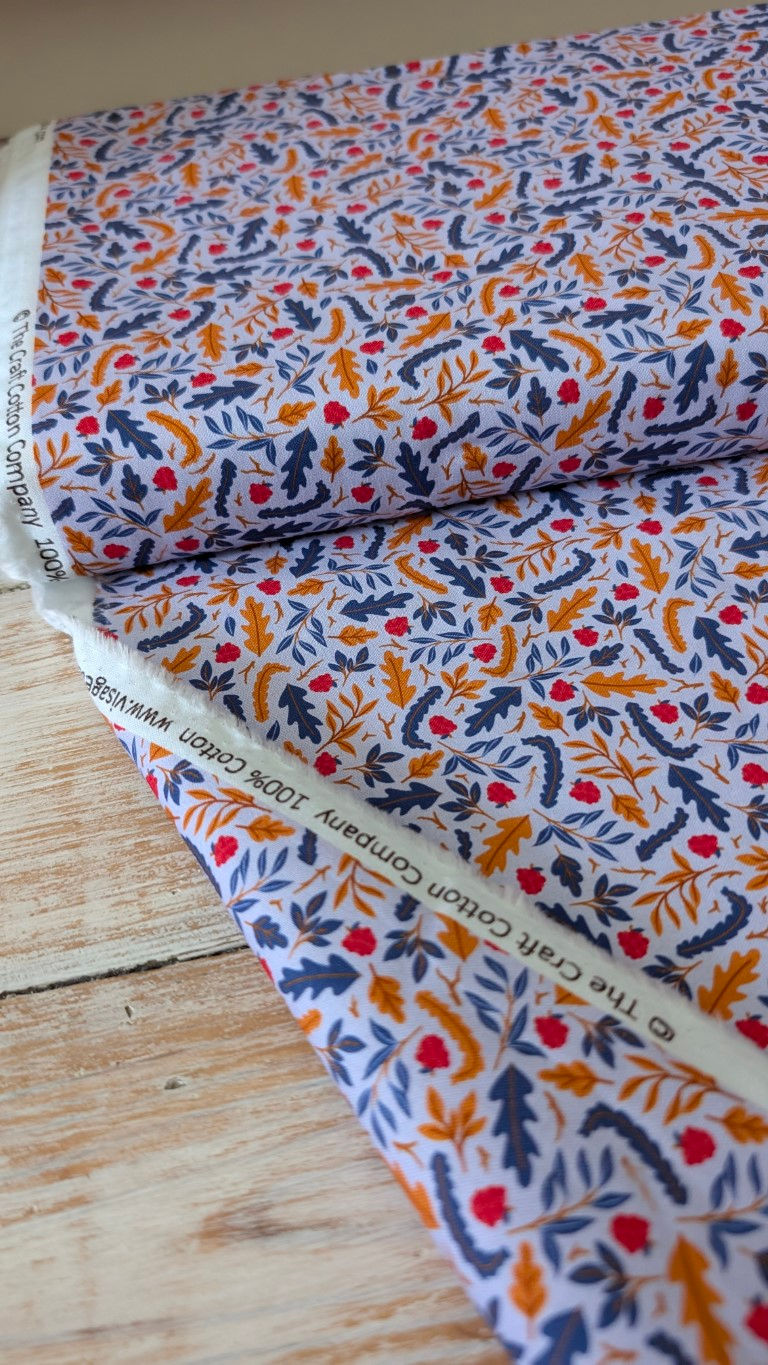Thumbnail: Fabric roll with visible text: 100% Cotton, The Craft Cotton Company, leaves.