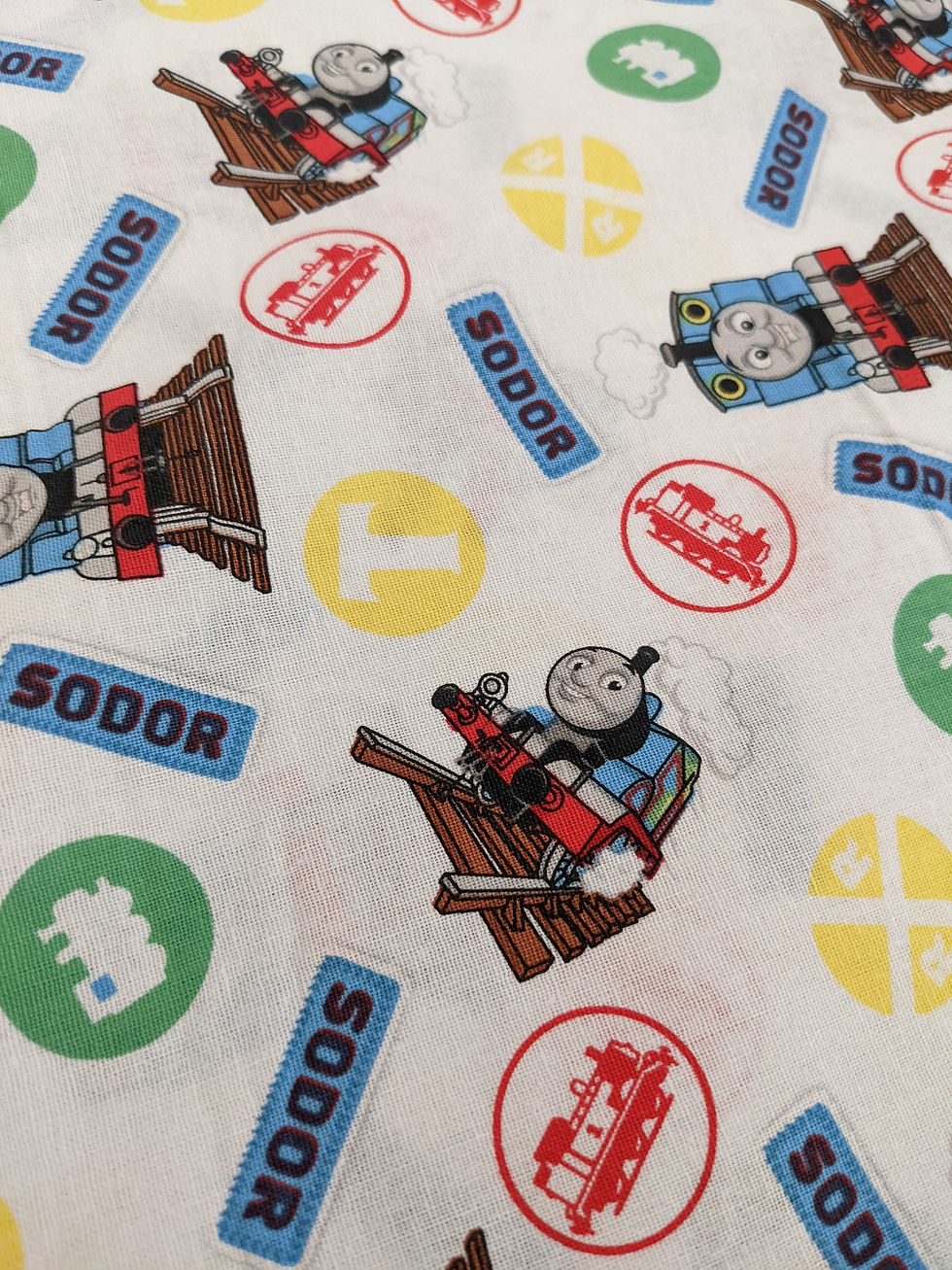 Thumbnail: Thomas the Tank Engine fabric with the word SODOR and train designs. Blue Train Tracks - Thomas and Friends Fabric.