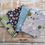 Thumbnail: Stacked fabric pieces with farm animals and tractors patterns, The Fabric Squirrel.