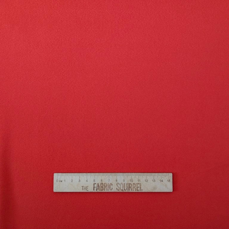 Thumbnail: Red fabric with ruler showcasing measurements; The Fabric Squirrel