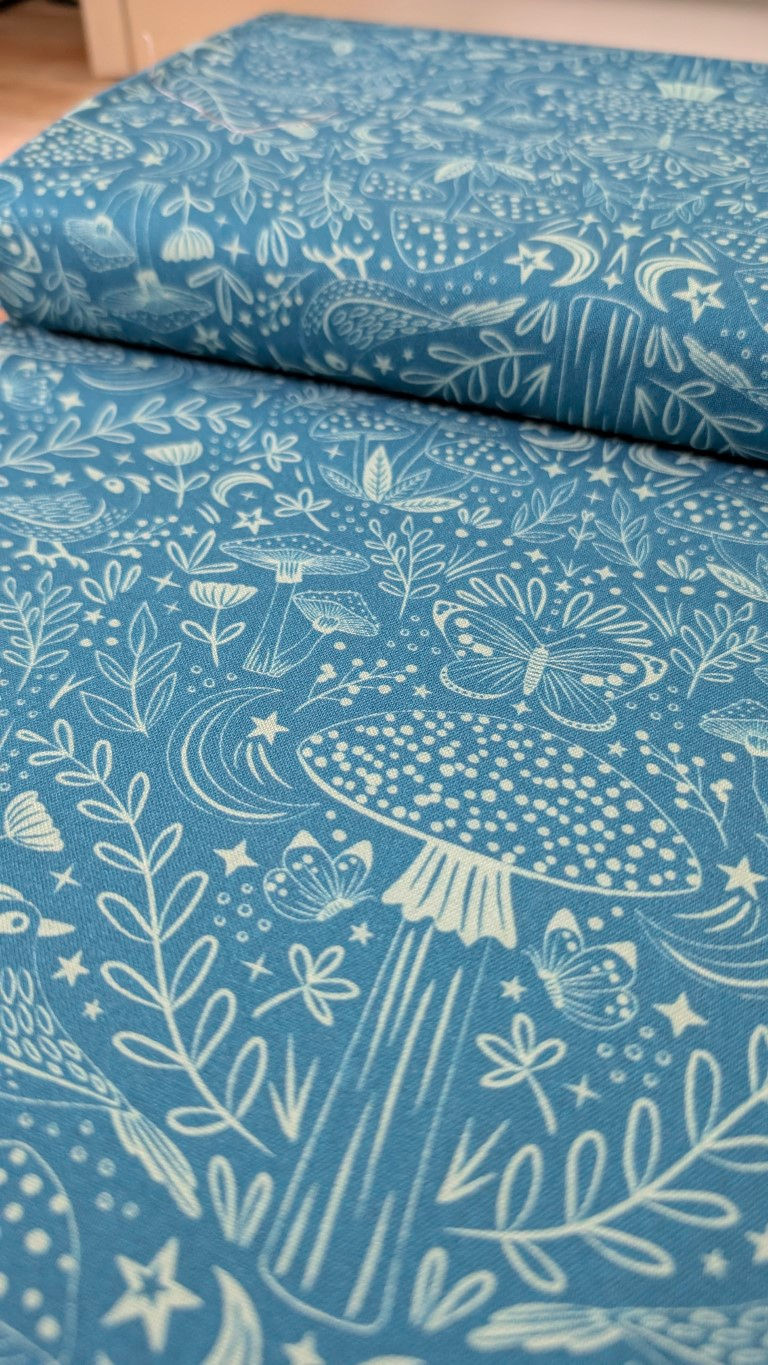 Thumbnail: Blue fabric with white mushrooms, plants and butterflies - Twilight Caps Fabric - Nightfall Forest | Craft Cotton Co