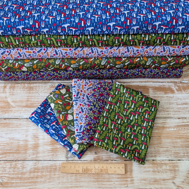 Thumbnail: Various color stacks of fabric. Ripe Berries Fabric - Nightfall Forest | Craft Cotton Co