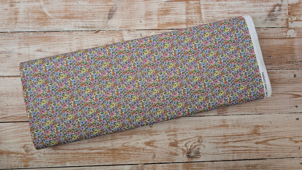 Thumbnail: Floral fabric folded on wooden surface, Tea and Toadstools Fabric - Cottage Bliss Organic Woven Cotton.