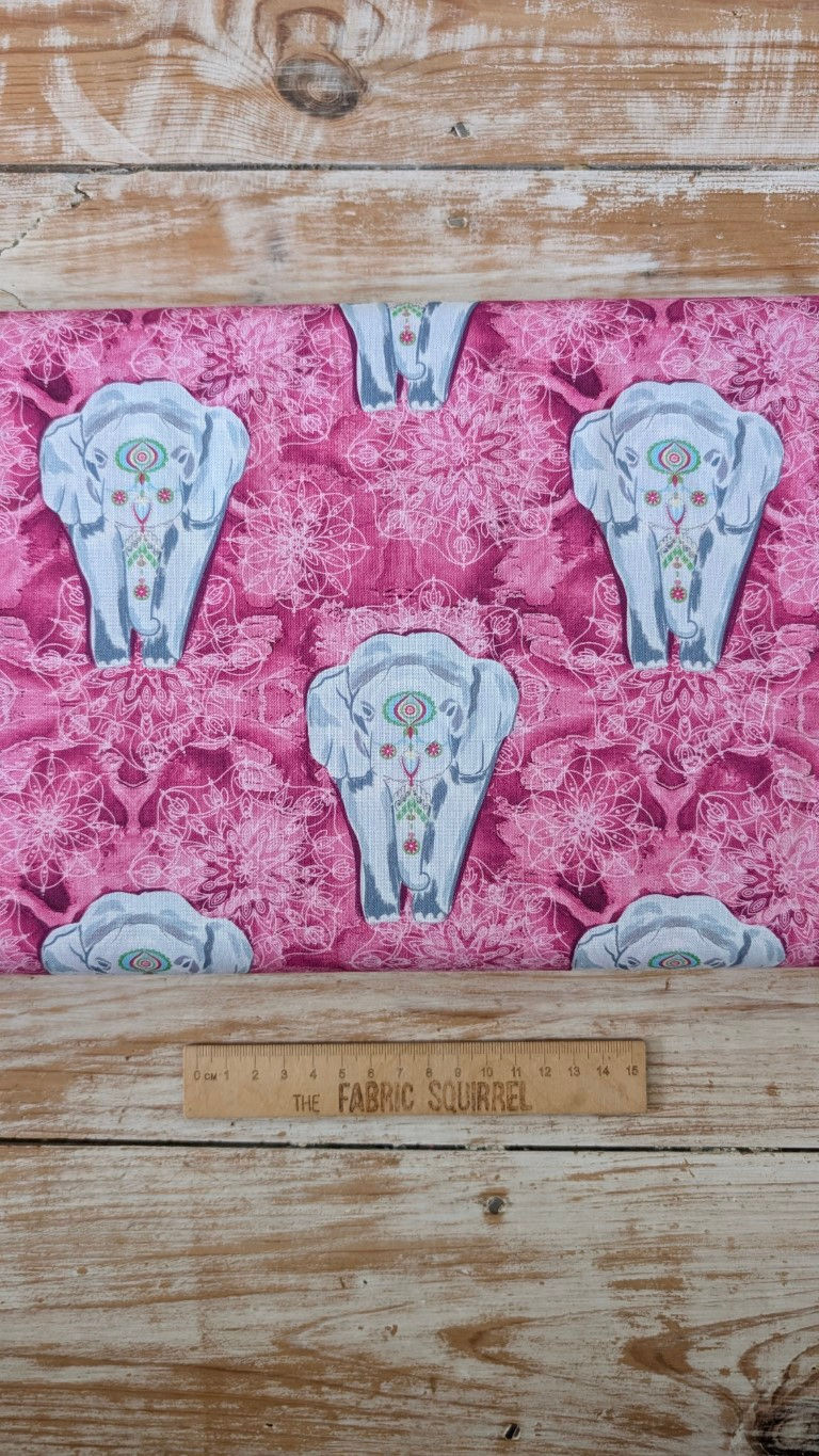 Thumbnail: Pink fabric with elephant shapes and a ruler; The Fabric Squirrel designs.