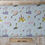Thumbnail: Fabric with cartoon characters and text, Pale Grey Shimmer Fabric - 100% Cotton. The Fabric Squirrel