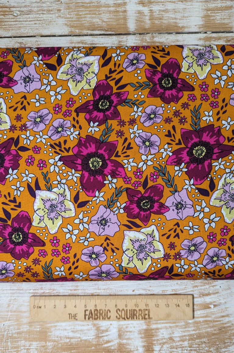 Thumbnail: Floral fabric with large flowers, in orange, pink, and white. The Fabric Squirrel
