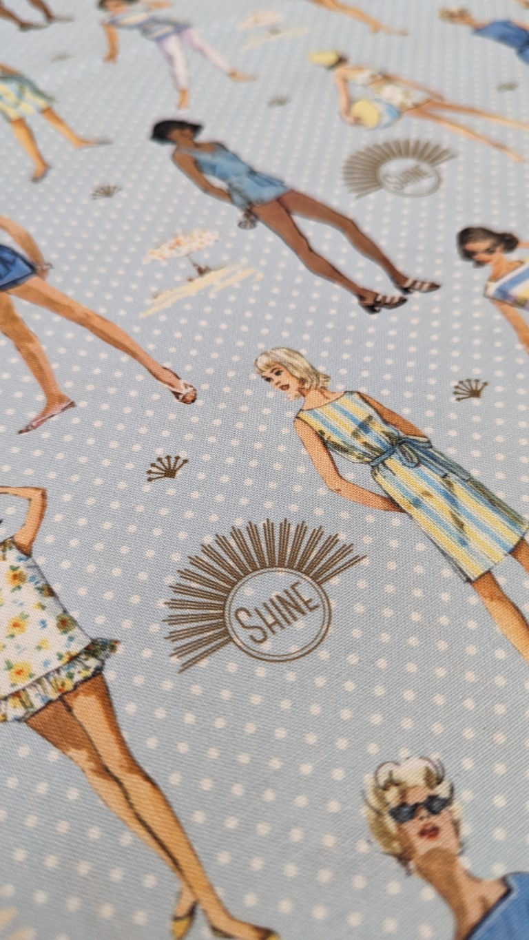 Thumbnail: Fabric with women in vintage dresses, Shine text, and polka dots pattern.
