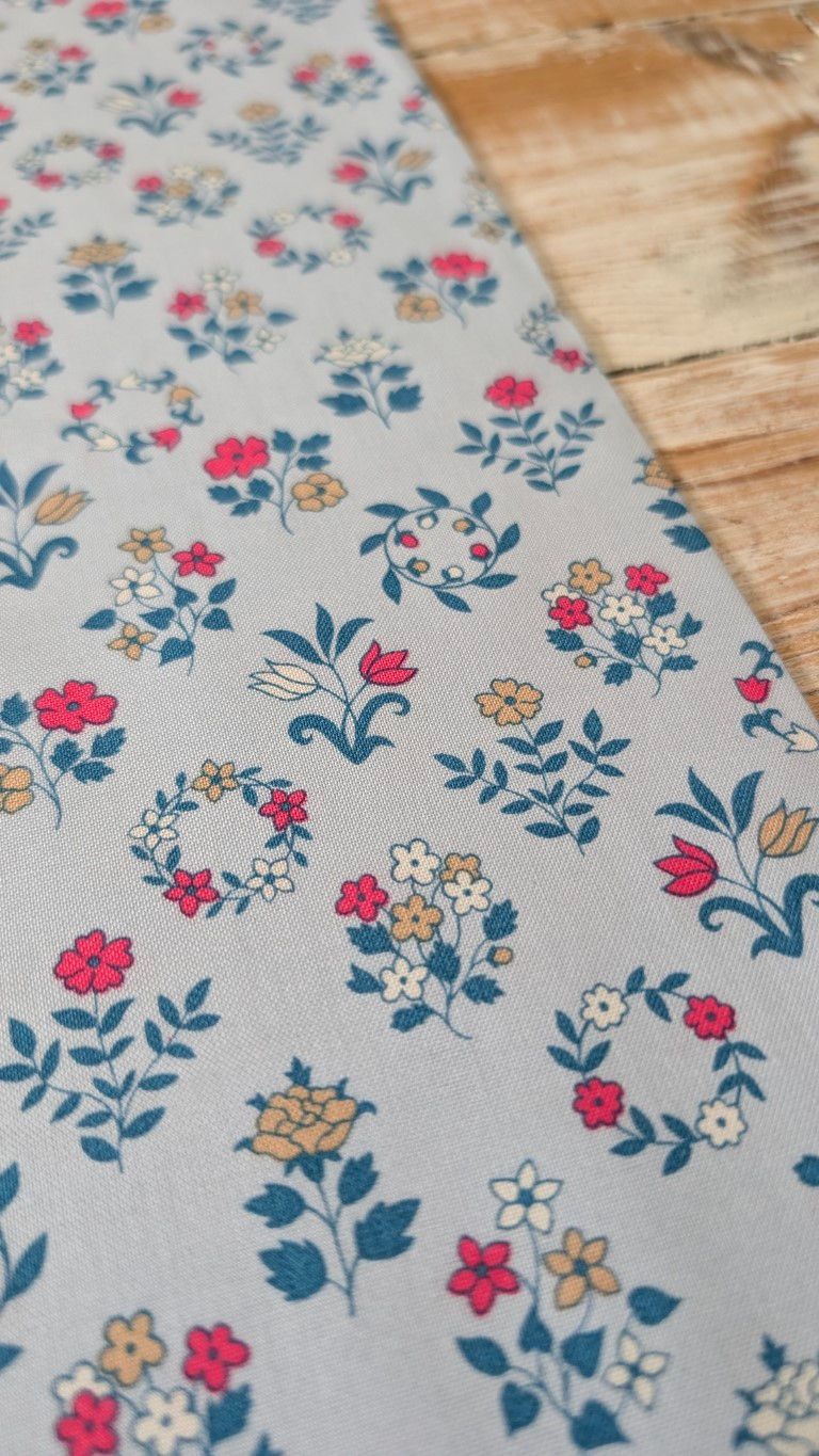 Thumbnail: Floral fabric with red, white, and yellow flowers on grey background. The Fabric Squirrel
