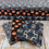 Thumbnail: Stacked Halloween fabrics with pumpkins and stars patterns, ready for crafting with The Fabric Squirrel