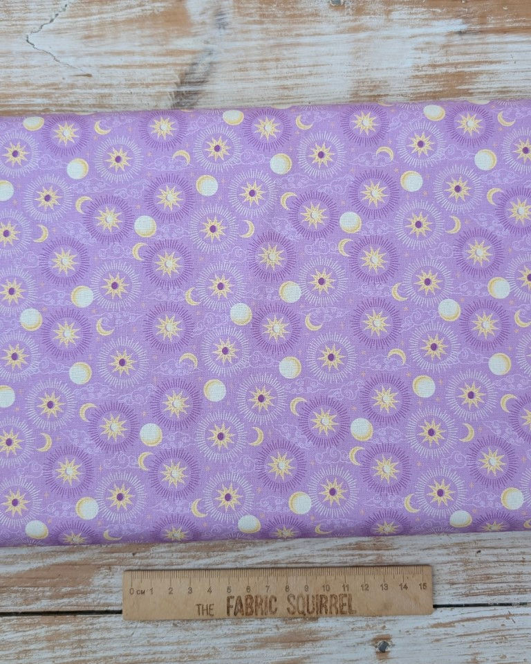 Thumbnail: Fabric with celestial pattern featuring moons and stars, purple background.