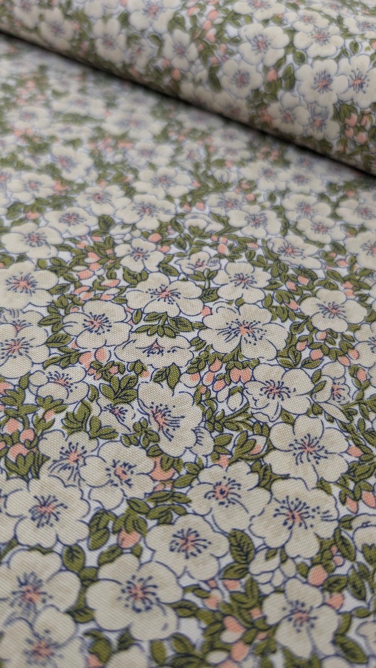Thumbnail: Floral fabric with white flowers and green leaves on a light background. The Fabric Squirrel