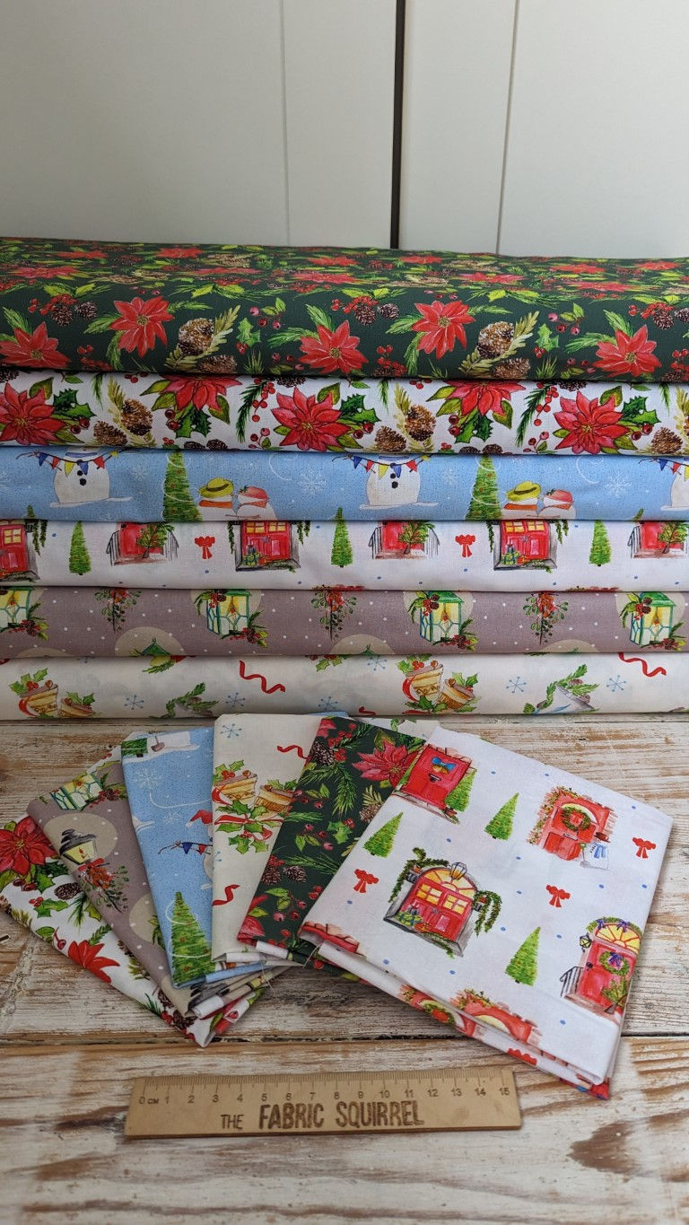 Thumbnail: Festive Christmas fabric rolls stacked; Poinsettias, presents and texturing. Festive Doors Fabric - A Traditional Christmas by Debbie Shore.