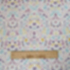 Easter fabric with bunnies, eggs, flowers, and text, by The Fabric Squirrel.