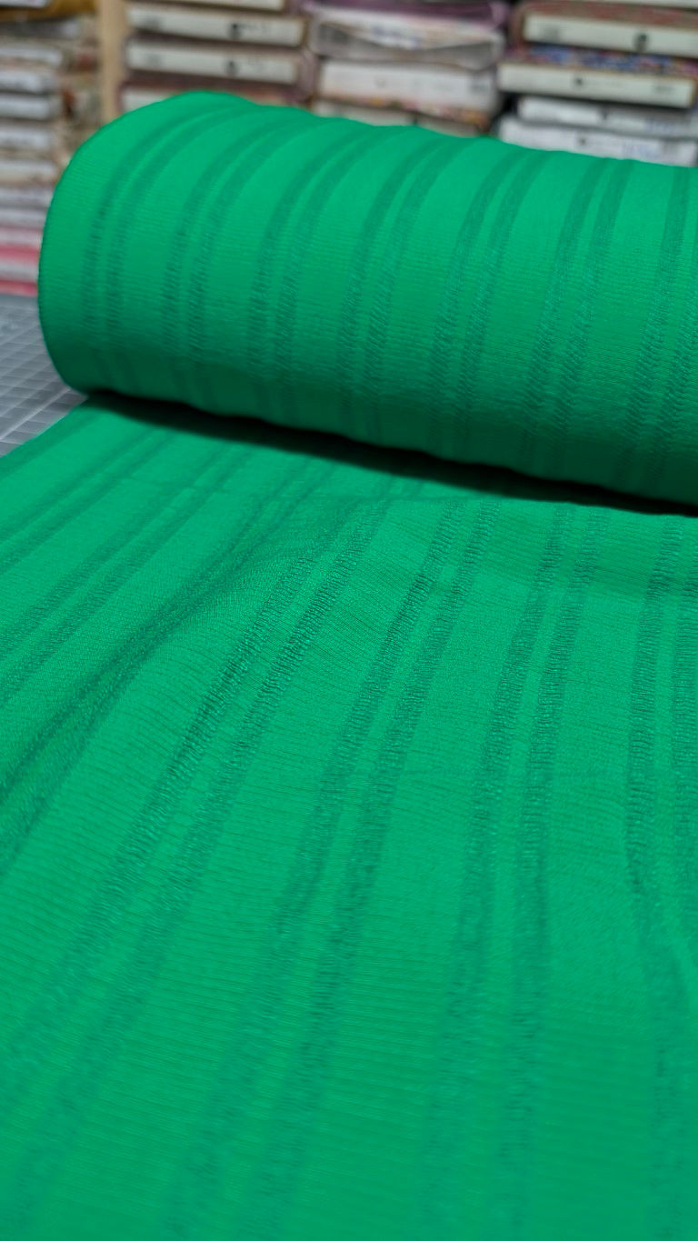 Thumbnail: Green fabric roll with vertical stripes; textile background, close-up details