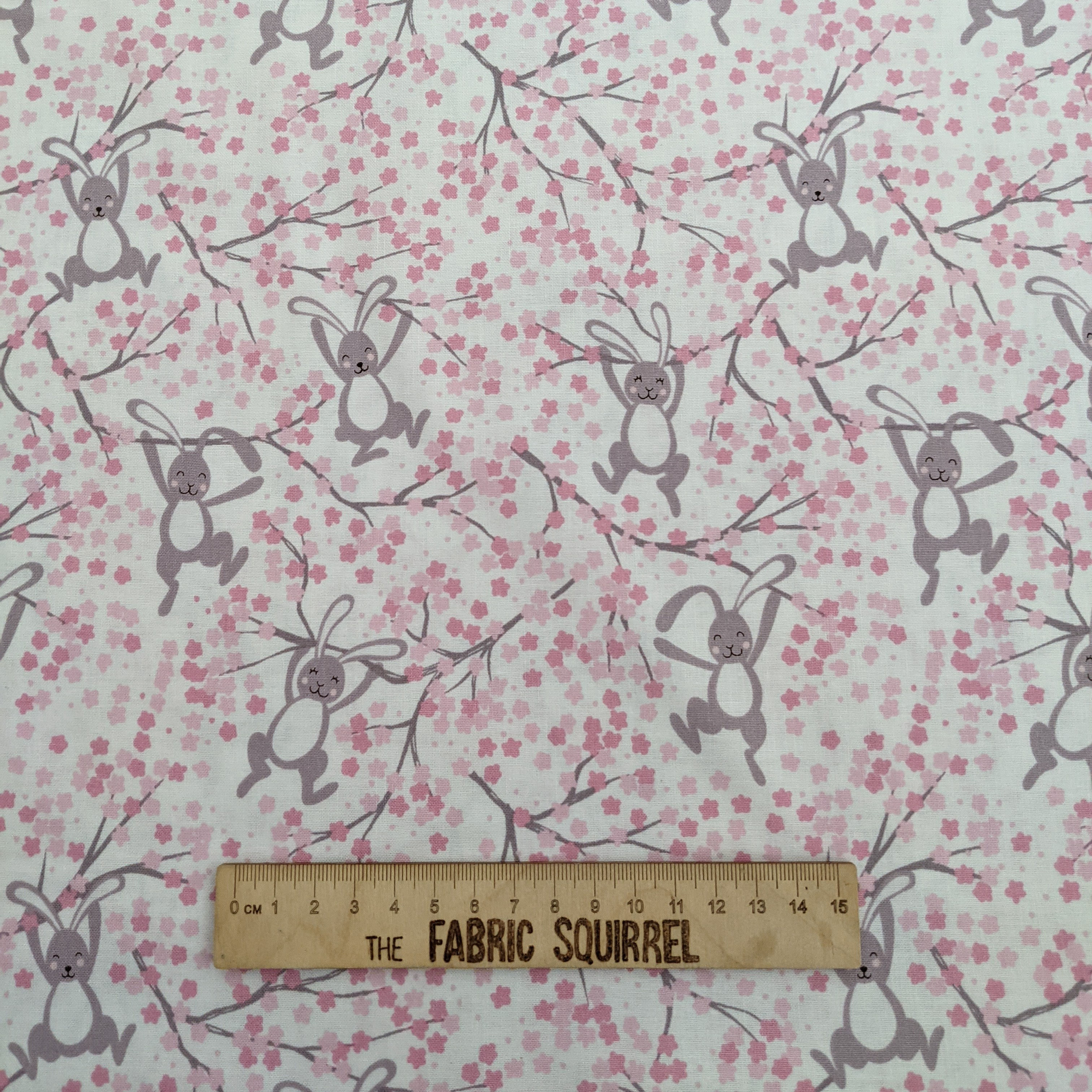 Fabric with rabbits hanging from floral branches, The Fabric Squirrel.