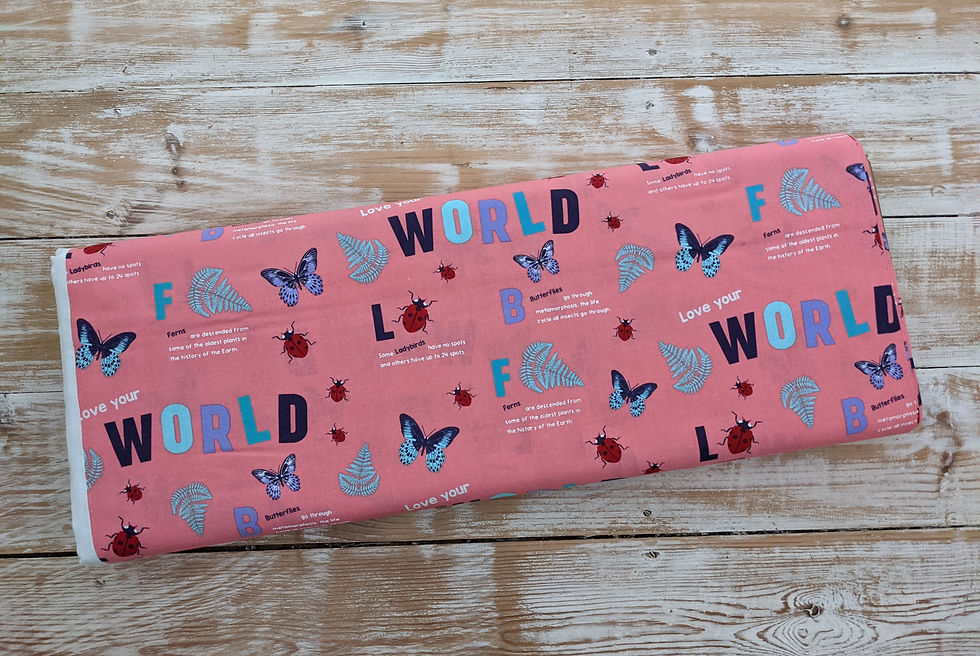 Thumbnail: Pink fabric with butterflies and the words WORLD, LOVE, and BLUE