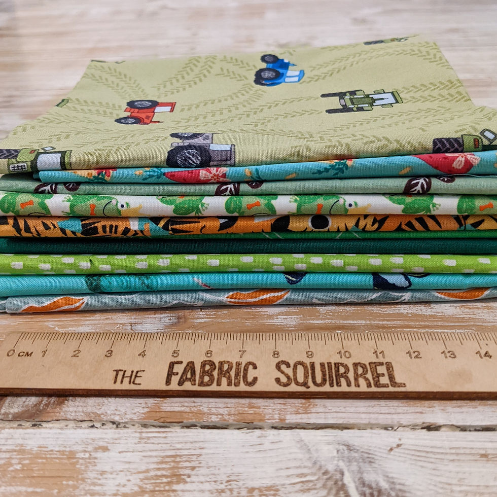 Thumbnail: Collection of colorful fabric with the text The Fabric Squirrel and ruler.