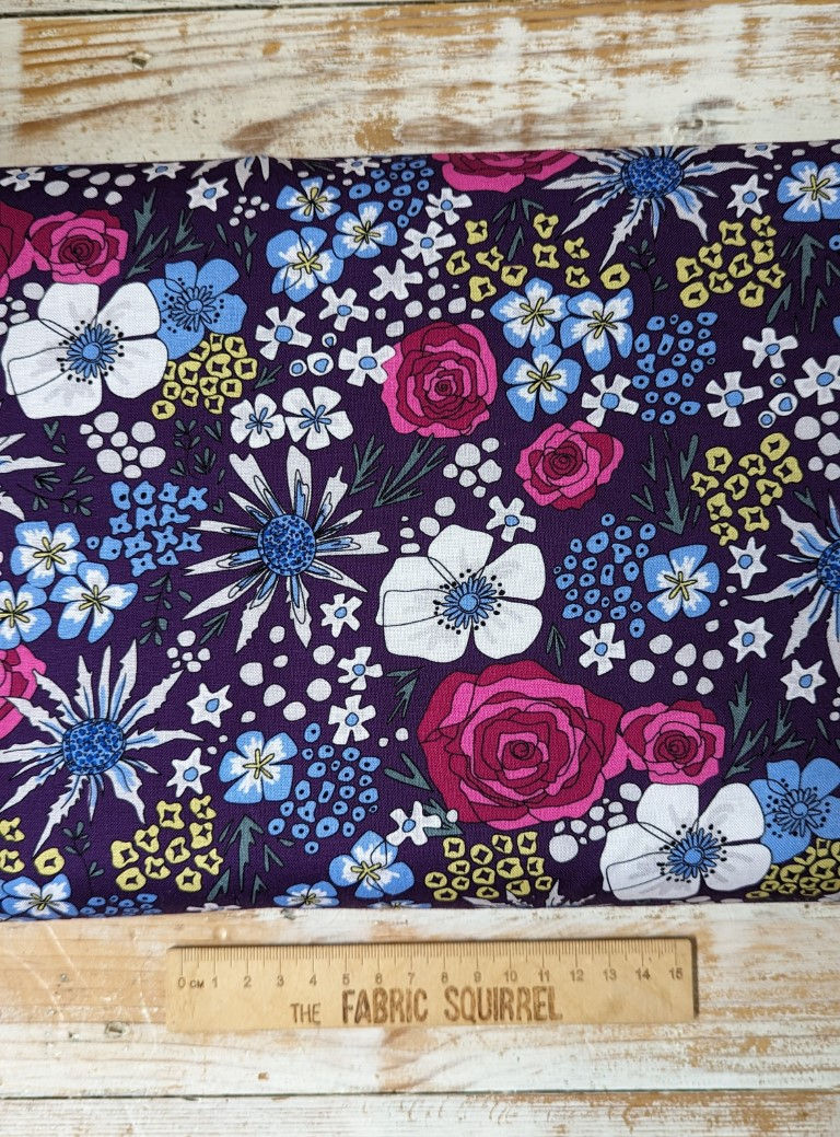 Thumbnail: Floral fabric with pink, white, and blue flowers on dark purple background.