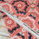 Thumbnail: Coral fabric with floral and butterfly patterns, 