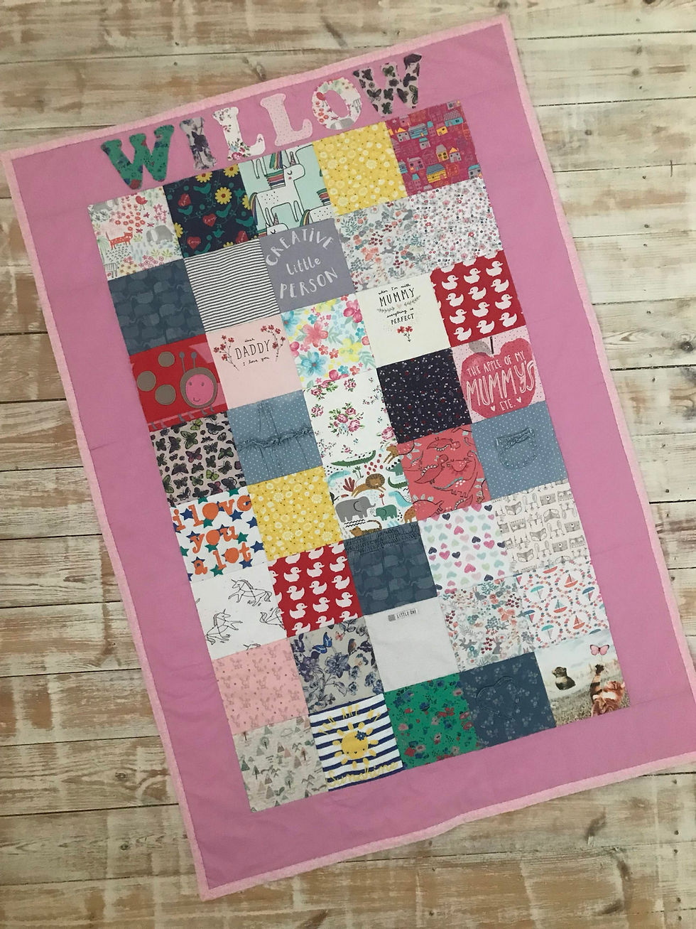 Thumbnail: Willow keepsake quilt with pink border