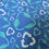 Thumbnail: Blue fabric with white and green recycling symbols The Fabric Squirrel