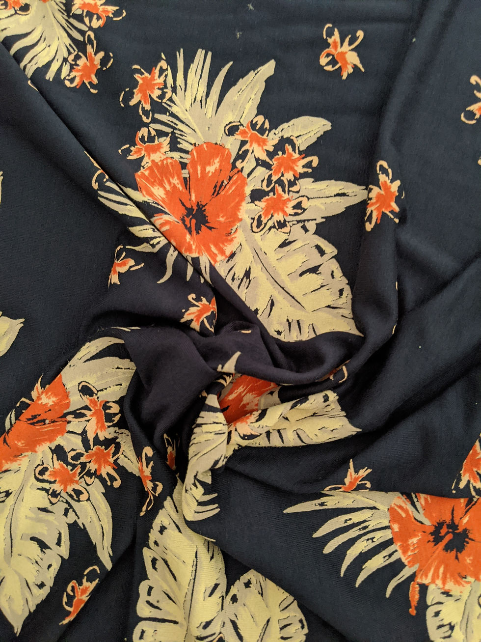 Thumbnail: Navy fabric with orange and cream floral pattern, close-up details.