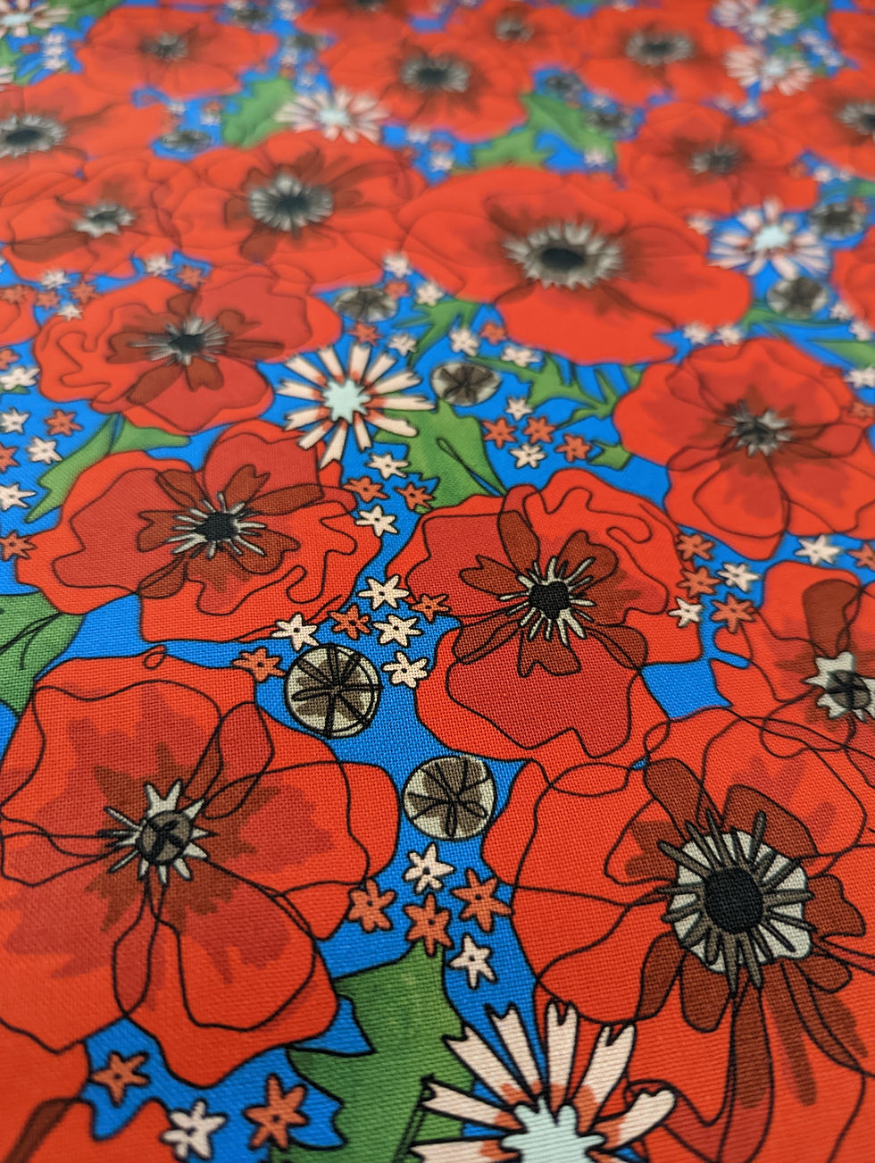 Red poppies on blue background fabric, floral design, Jennie's Greens collection