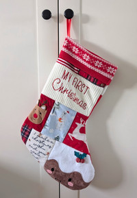 Christmas stocking made from babies first Christmas clothes