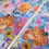 Thumbnail: Colorful floral fabric with text from FIGO Fabrics Company. Sakura Oriental Fabric.