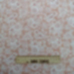 Pink fabric with white floral pattern and ruler, The Fabric Squirrel.