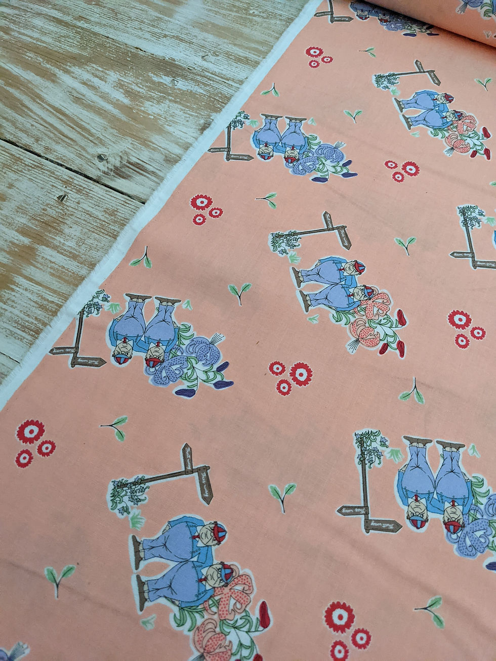 Thumbnail: Fabric with sewing machines and flowers. Measure Twice from Maywood Studios. Pale pink.
