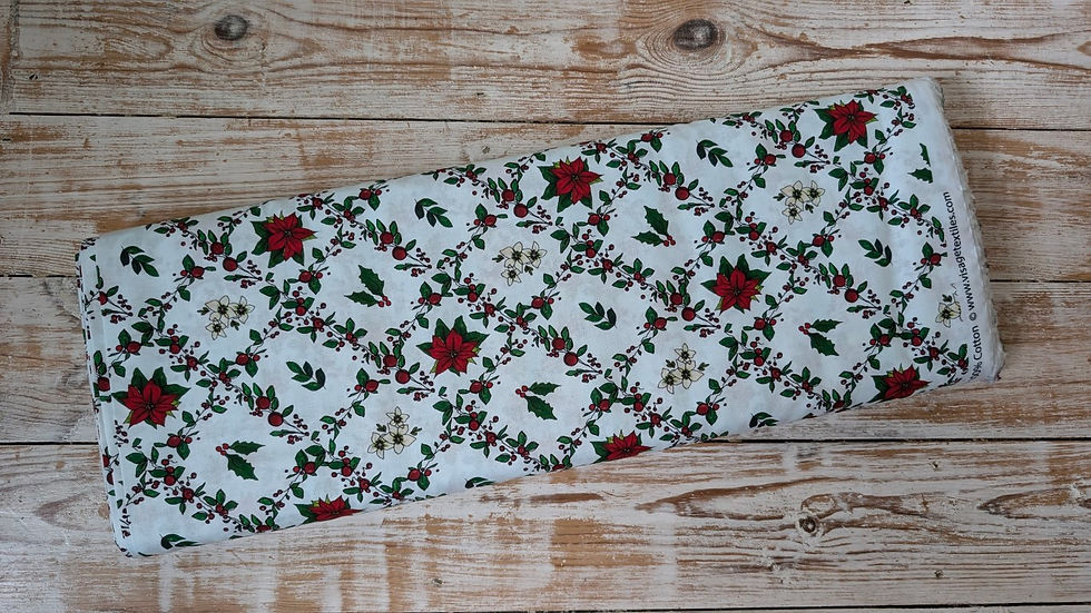 Thumbnail: Floral fabric with red flowers, green leaves on white background and wooden surface