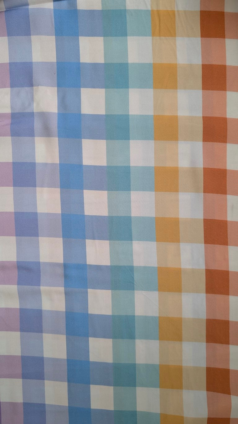 Thumbnail: Colorful checkered fabric pattern in various shades of blue, orange, and white.