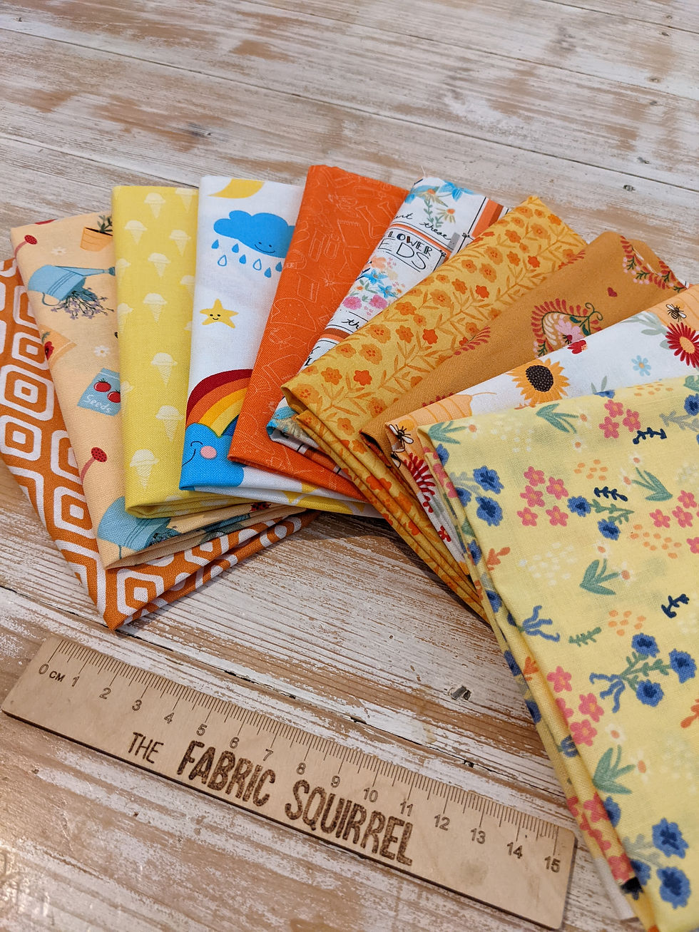 Thumbnail: Colorful fabric pieces with various patterns, including rainbows. The Fabric Squirrel designs.
