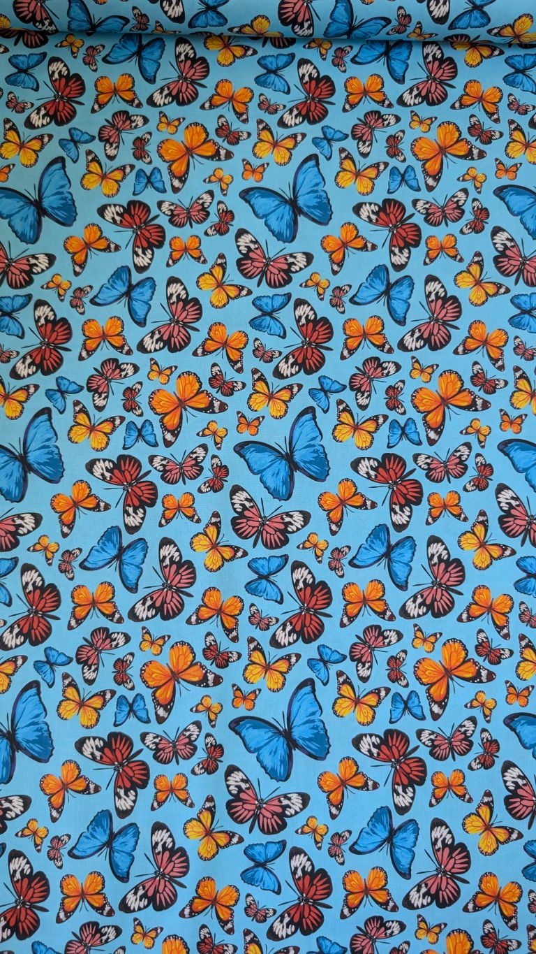 Thumbnail: Colorful butterflies on light blue fabric background, The Fabric Squirrel