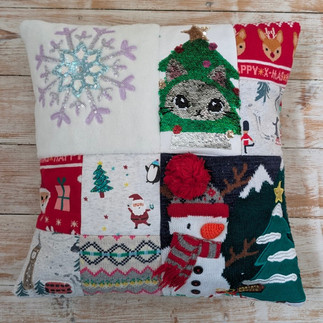 Christmas cushion made from children's first Christmas clothes