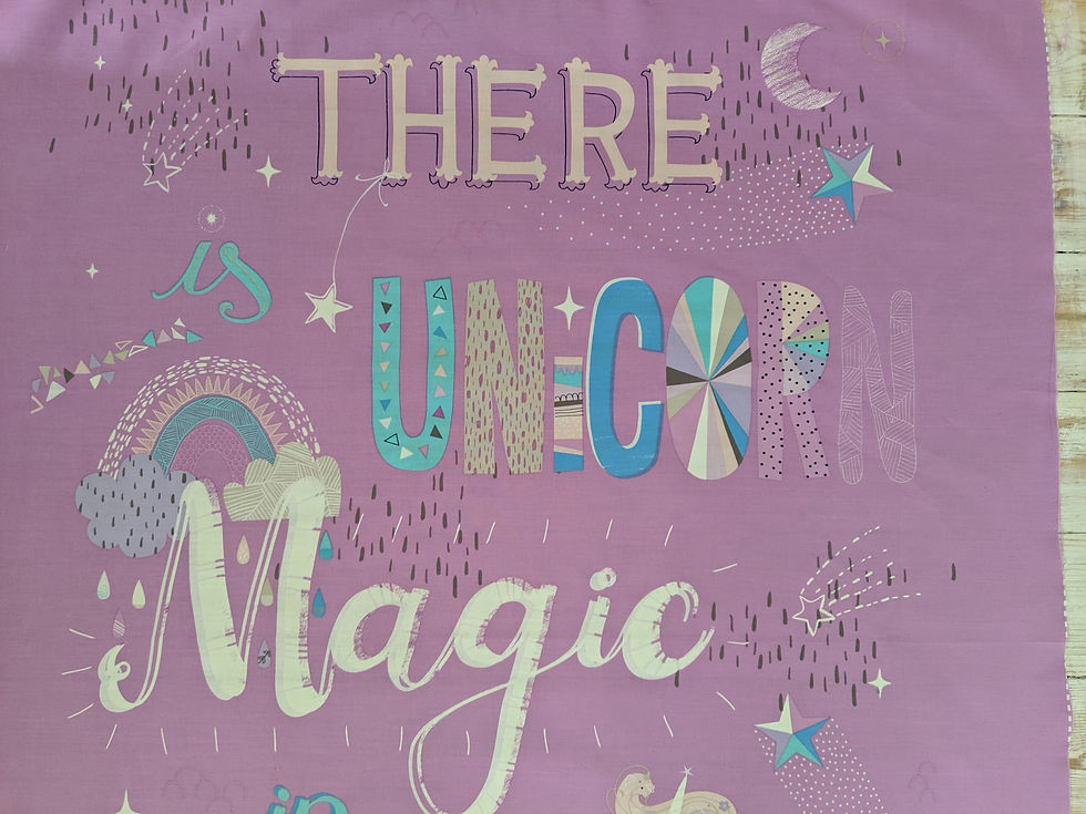 Thumbnail: Purple shirt with the words There Unicorn Magic in a playful font.