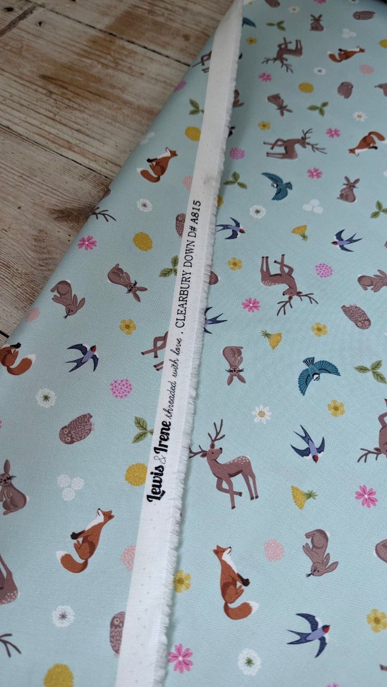 Thumbnail: Fabric, Lewis Irene, Clearbury Down fabric includes woodland animal prints, and text.